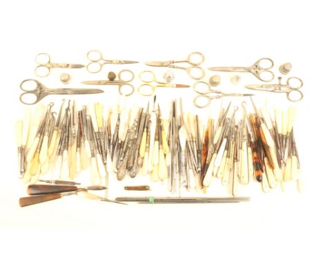 A large selection of standard format sewing tools mostly with bone or mother of pearl handles, button hooks, stilettos etc to