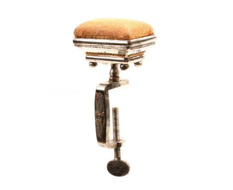 A good mid 19th Century diminutive steel sewing clamp the rectangular frame with two colour metal decoration below a rectangu