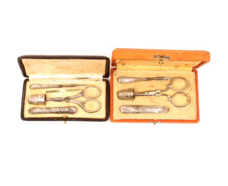 Two cased etuis comprising a maroon leather rectangular example by ‘Vilain, Beauvais’ with five leaf decorated silver tools, 