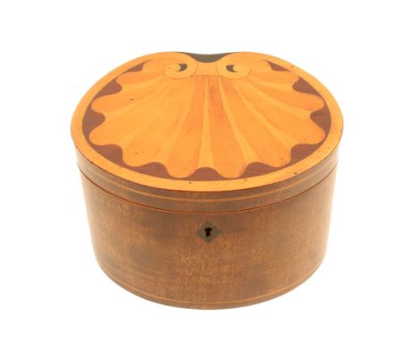 A late 19th Century mahogany tea caddy of shaped oval outline, the sides with boxwood lines, the hinged lid inlaid in pale wo