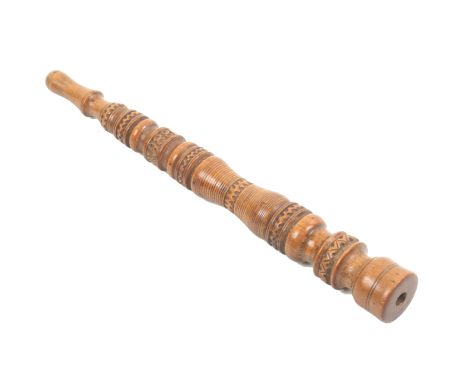 A dated turned tapering boxwood knitting stick with carved zig zag bands and initialled and dated ‘KK 1886’, 16.5cm.