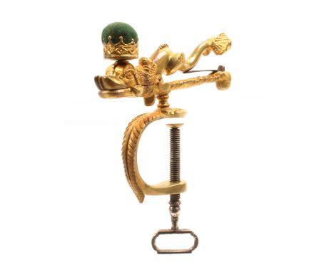 A good 19th Century cast brass sewing clamp modelled as a dolphin surmounted by a pin cushion modelled as a crown, the decora