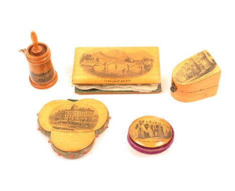 Mauchline ware – sewing – five pieces comprising a slant top bow front thimble case (Cardiff Castle) 3.5cm, a churn form tape