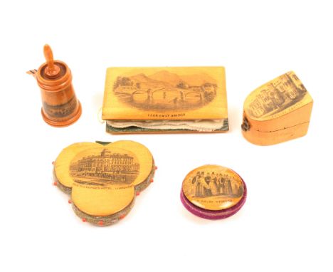 Mauchline ware – sewing – five pieces comprising a slant top bow front thimble case (Cardiff Castle) 3.5cm, a churn form tape