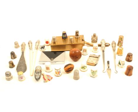 A mixed lot comprising modern thimbles including four silver, four silver handled dressing implements, silver trowel book mar