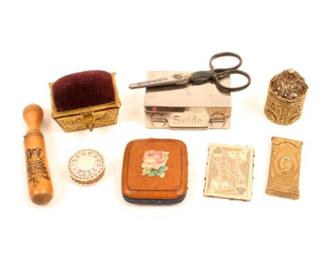 A mixed lot – sewing – comprising a silver gilt filigree cylinder form box, 4.6cm, a pin card as the jack of clubs, a turned 