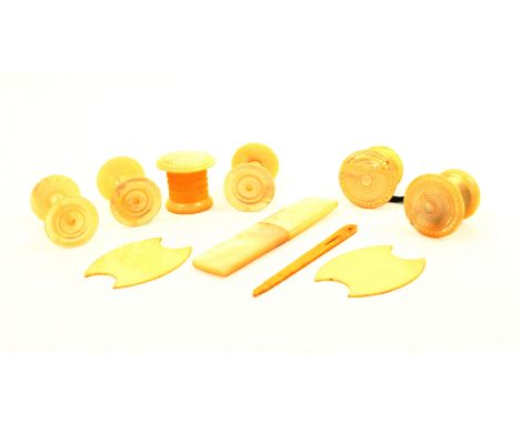 A group of mother of pearl and other sewing tools comprising a set of waxer, emery and tape measure, with tape, three matchin