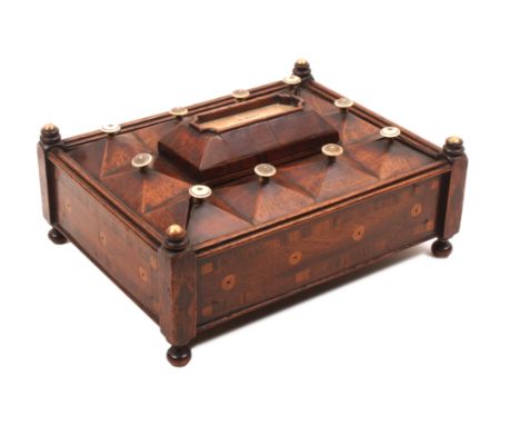 An unusual mahogany reel box dated 1839, of rectangular form raised on post from corners and ball feet, the sides crossbanded