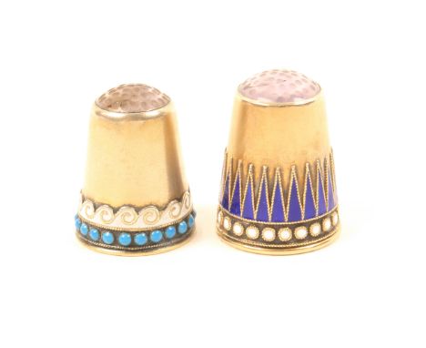 Two Norwegian enamel and silver stone top thimbles by Marius Hammer, comprising a silver gilt example with scrolling white wa