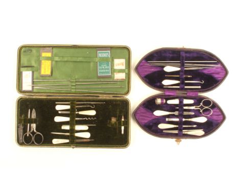 Two late 19th Century small format sewing companions comprising a large black leather rectangular example and a boat shaped p