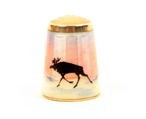 A Norwegian silver and enamel stone top thimble, by Aksel Holmsen, depicting a reindeer and trees in a typical winter landsca