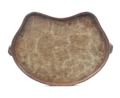 A ‘Mouseman’ Thompson oak kidney shaped tray, raised border and carved with two mice as carrying handles, 47cm wide.