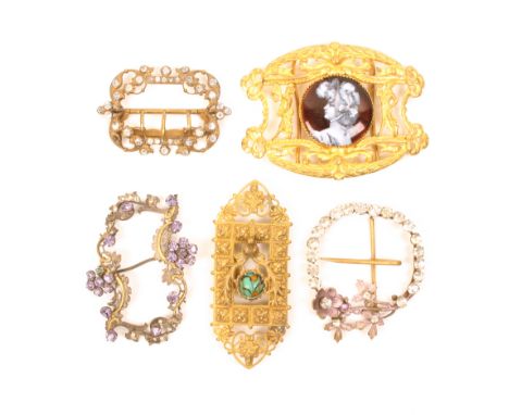 Five 19th and early 20th decorative waist buckles, comprising an oval pierced gilt example with male and female figure flanki