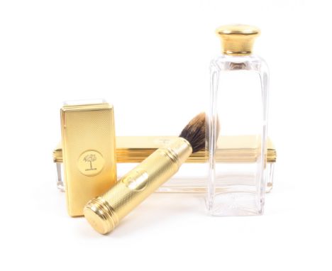 Four Victorian silver gilt accessories from a gentleman’s dressing case comprising a cylinder shaving brush, the head reversi