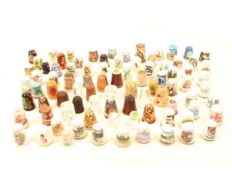 A collection of mostly modern thimbles, glass, ceramic, papier mache and wood. (80+)