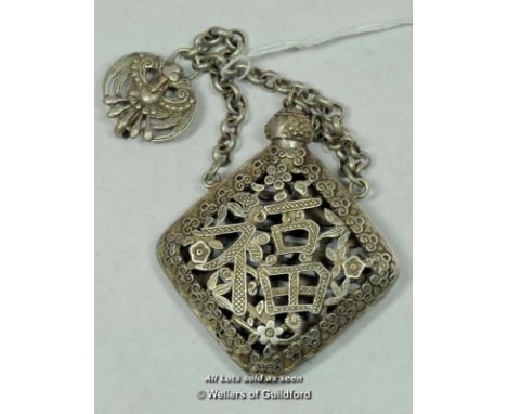 A Chinese white metal scent holder with suspension chain.