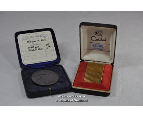 Buxton College medallion, unnamed but with card saying To R Milligan, cased; Colibri cigarette lighter, cased (2)