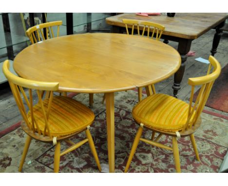 *Ercol dropleaf circular dining table and set of Ercol four stick back chairs