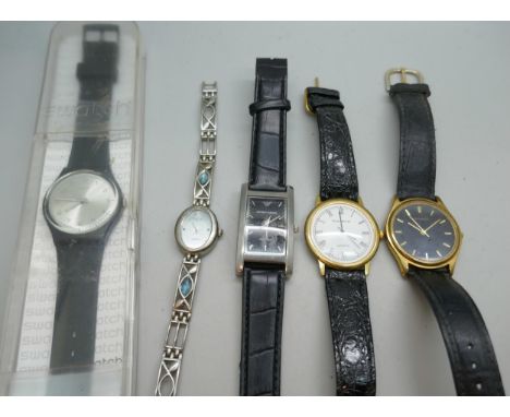 A collection of quartz watches including Swatch, Sekonda, and Emporio Armani