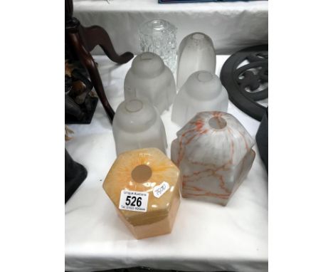 An assortment of glass lamp shades