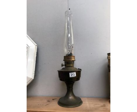 A brass based oil lamp