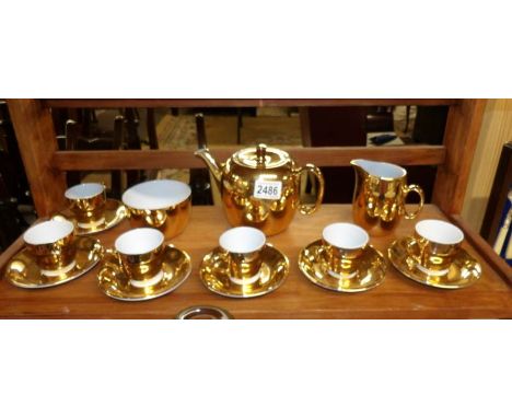 A 15 piece Royal Worcester gold coloured tea set comprising, teapot, sugar bowl, milk jug, 6 cups and 6 saucers.