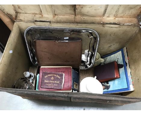 An old tin trunk and contents including small case, ABC train books and other items