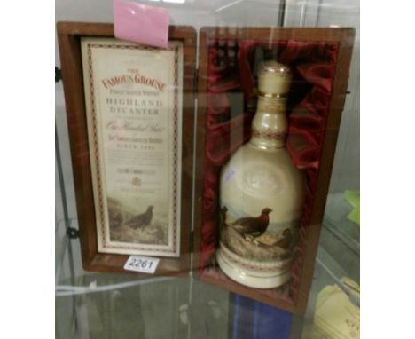 A boxed 'The Famous Grouse' finest scotch whisky to commemorate 100 years of Famous Grouse, since 1896.