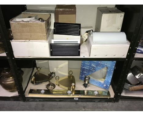 2 shelves of lighting including spot lights etc.