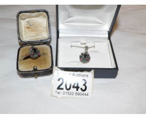 A stone set pendant with matching stone set ring (size N), both set in silver.