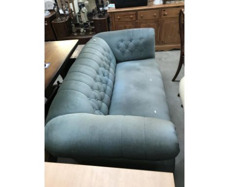 A deep buttoned Draylon covered Chesterfield sofa/settee