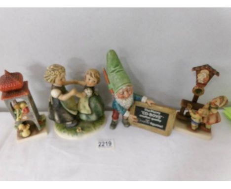A Goebel 'The Merry Co-boys' gnome figurine, a Goebel girls dancing group and 2 other Goebel figure groups.