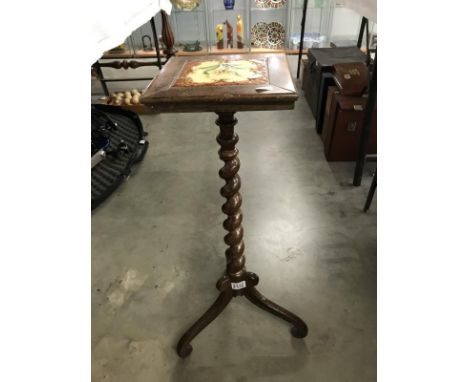 A Victorian rosewood barley twist tripod plant stand with tile inset top.