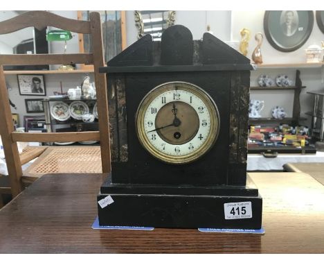 A black slate mantle clock for restoration