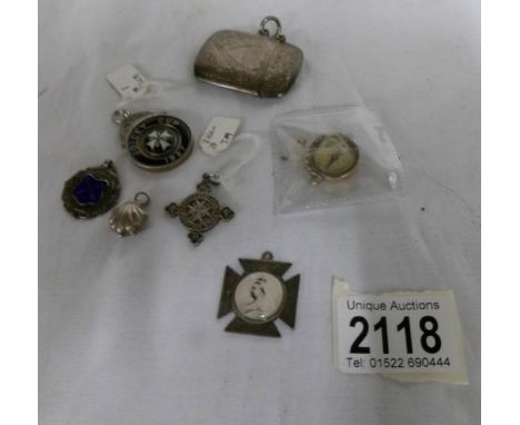 A 9ct gold fob as a compass, a silver vesta case and 5 silver fobs featuring a portrait of Queen Victoria, an oyster shell wi