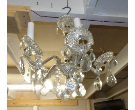 A 5 lamp glass chandelier.