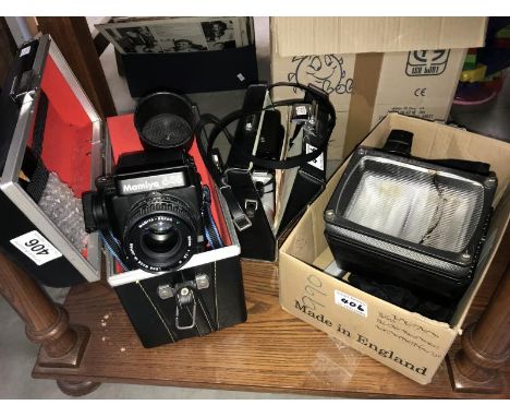 A Mamiya 645 camera and accessories