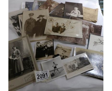 A quantity of black and white portrait photographs including some with postcard backs.