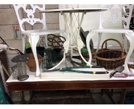A quantity of garden bird feeders, baskets, tools etc.