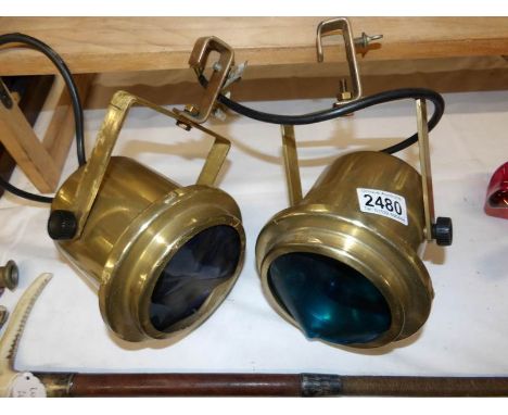 A pair of vintage style stage spot lights.