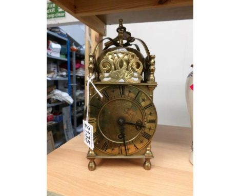 A brass clock.
