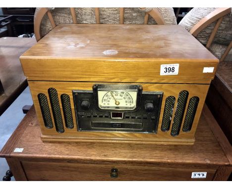 A vintage style radiogram with record player and compact disc