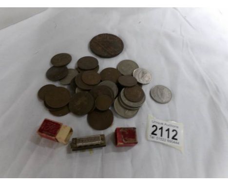 A Lusitania medallion, a boxed miniature Hohner No.39 harmonica and a quantity of UK coins.