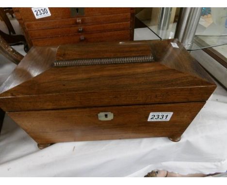 A 19th century mahogany tea caddy.