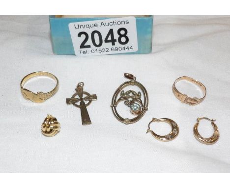 A mixed lot of gold items including pair of earrings, 9ct gold cross, gold ring etc.,