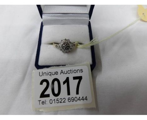 A gold cluster ring, (tests as gold, markings worn but indicate it could be 14ct).