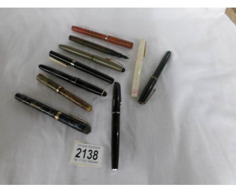 4 vintage Osmiroid fountain pens, 4 vintage Waterman's fountain pens, a Conway Stewart fountain pen and a Platignum fountain 