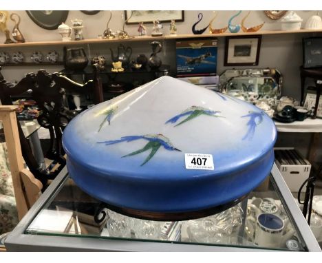 A vintage fly catcher lamp shade featuring birds