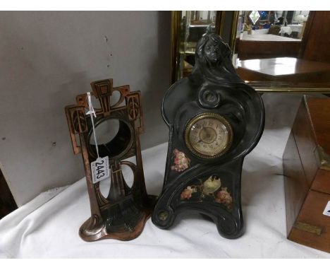 An art nouveau metal clock case and a Bretby mantel clock.