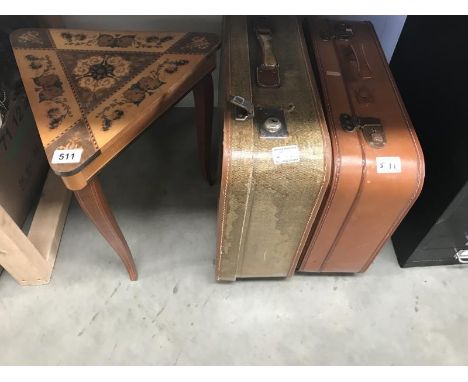 2 vintage suitcases and a musical side table